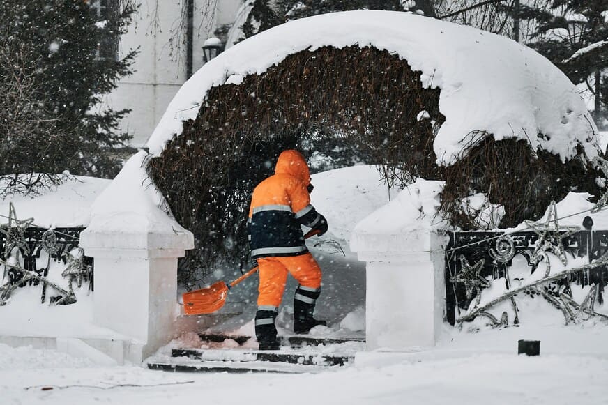 Crew de-icing sidewalks at dawn